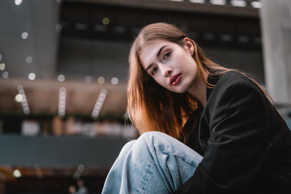 Stylish woman in Vienna with modern fashion vibes and city backdrop.