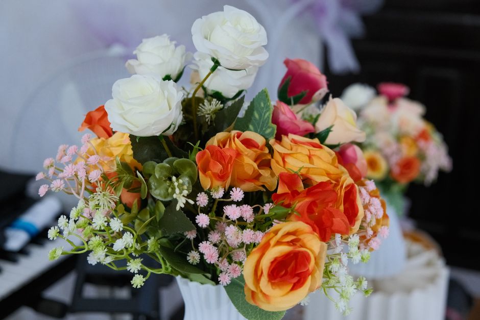 A colorful arrangement of roses and daisies in full bloom, perfect for celebrations.