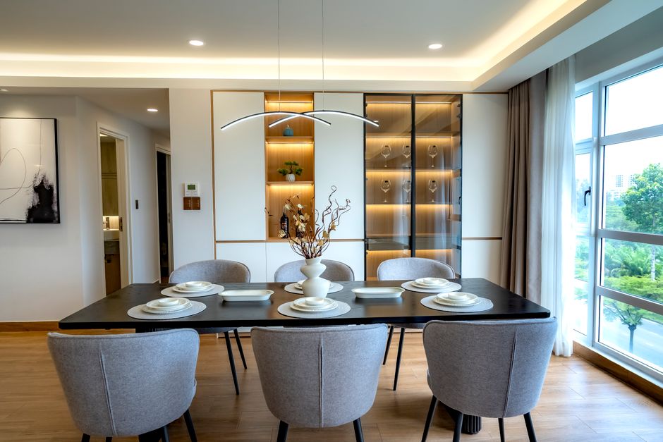Sleek modern dining room featuring elegant decor, soft lighting, and a minimalist aesthetic.