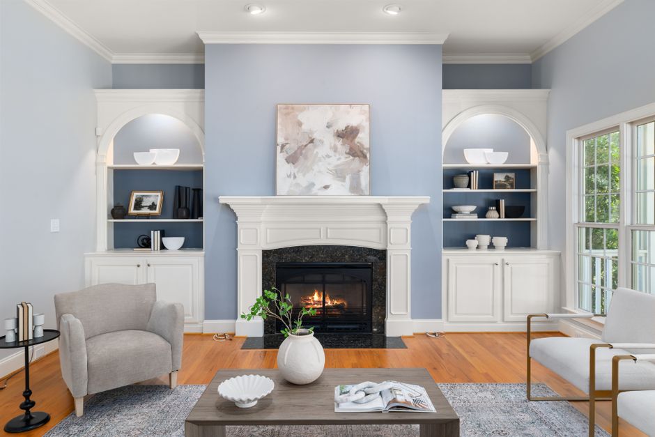 Stylish living room with a modern fireplace, elegant decor, and cozy seating.